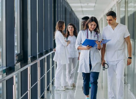 team-young-specialist-doctors-standing-corridor-hospital